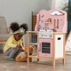 Viga Toys. Детская кухня из дерева с посудой  PolarB розовая (44046)